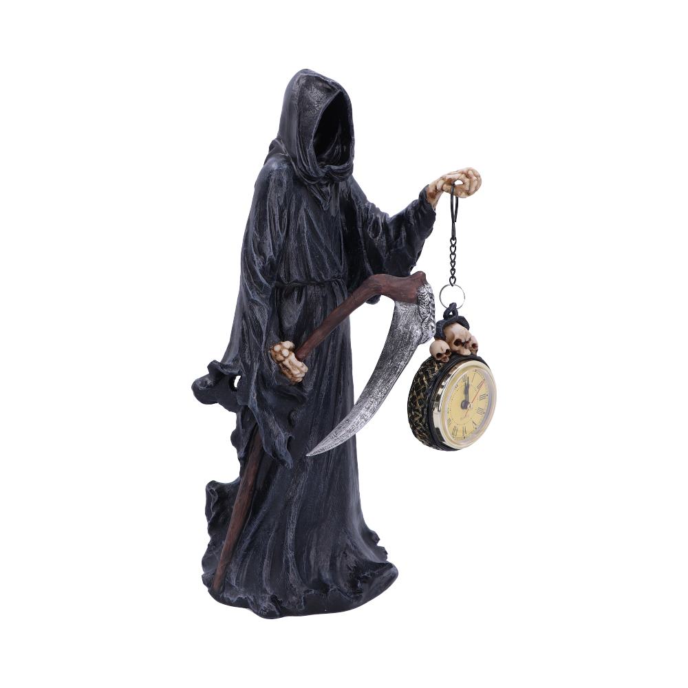 A Grim Reaper statue holds a scythe and a pocket watch adorned with skulls; it is isolated on a white background.