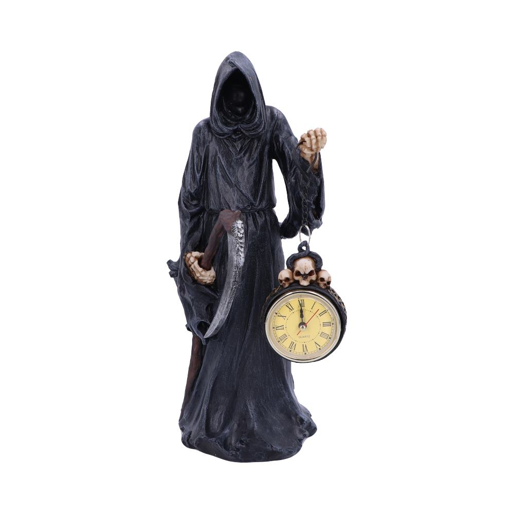A Grim Reaper figurine holds a scythe and a pocket watch adorned with skulls, against a white background.