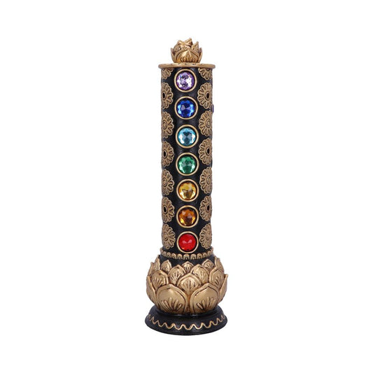 A black incense burner, adorned with gold detailing and seven colored gemstones, stands upright against a white background.
