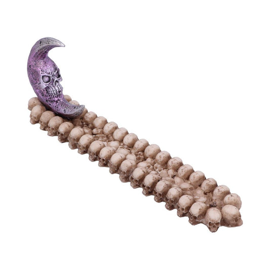 A purple crescent moon with a skull face rests upright on a long row of beige skulls. The background is plain white.
