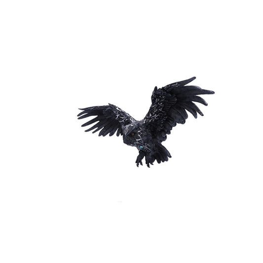 A large, black owl, adorned with silver markings, flies against a white background.