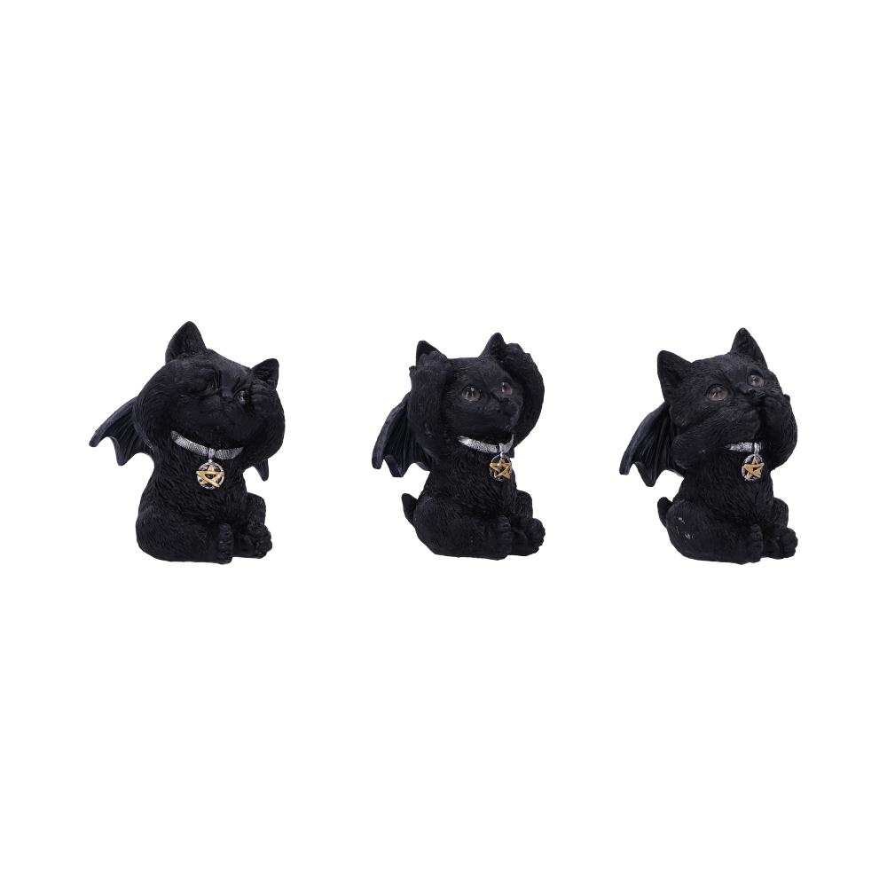Three black cat figurines with bat wings, each holding paws over eyes, ears, and mouth respectively, sit wearing pentacle necklaces against a plain white background.