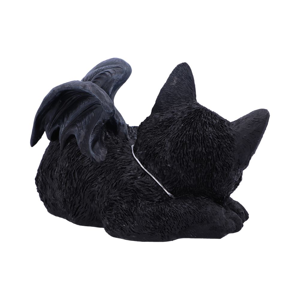 A black cat figurine, lying down with eyes closed, features small bat-like wings on its back. The setting is a plain white background.