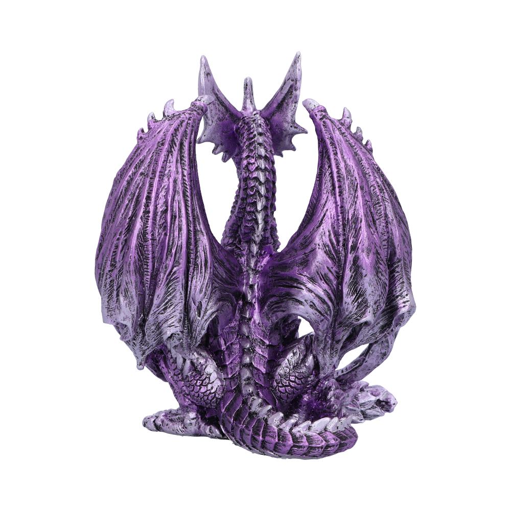 A purple and silver dragon figurine rests with wings partially folded, its back facing the viewer. The intricate scales and fierce posture give an impression of power, set against a white background.