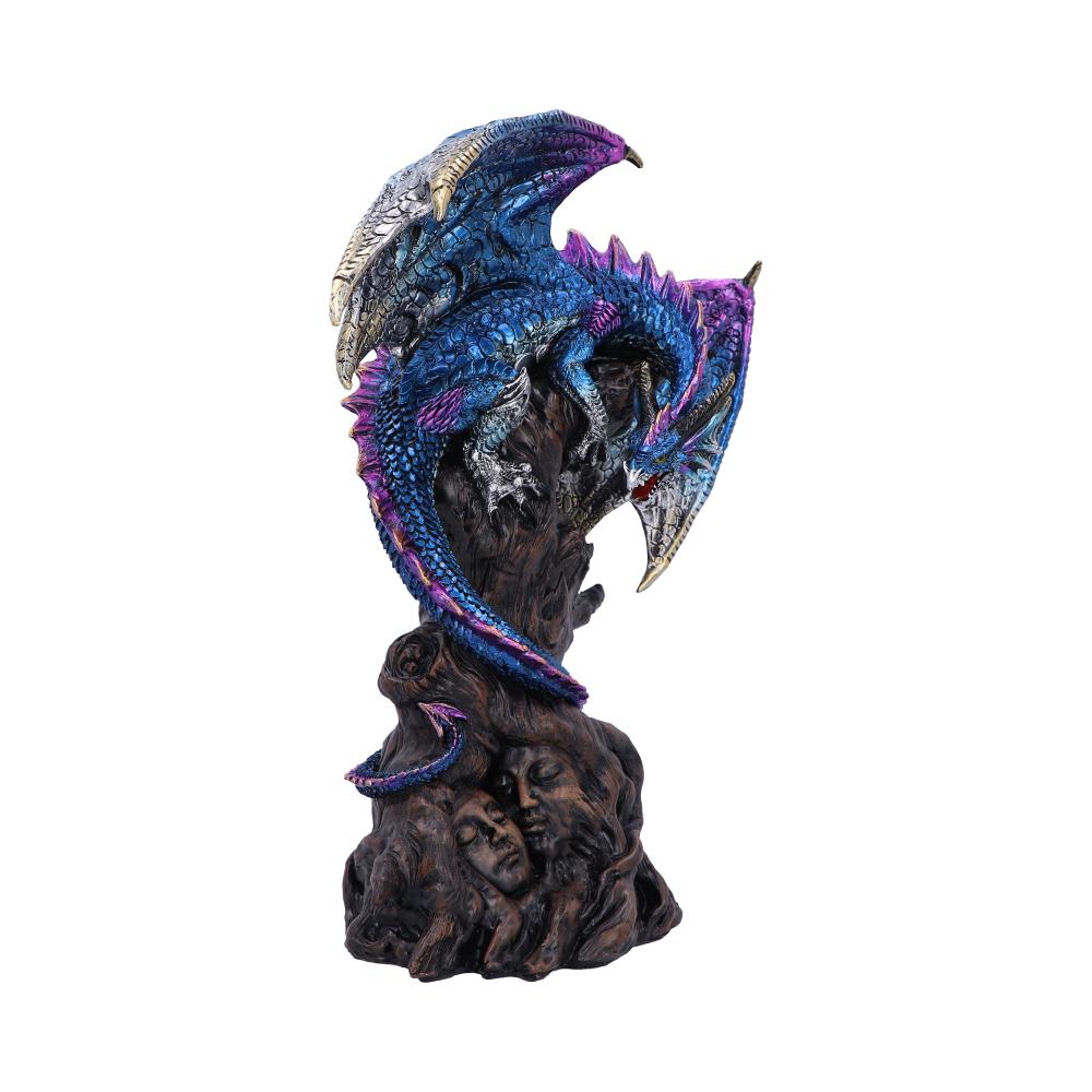 A blue and purple dragon is perched on a sculpture, intricately coiled around dark, carved faces. The dragon's wings are spread, and the scene appears mystical and ornate.
