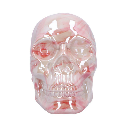 A glossy ceramic skull with pink and white marbled patterns, shown front-facing, set against a plain white backdrop.