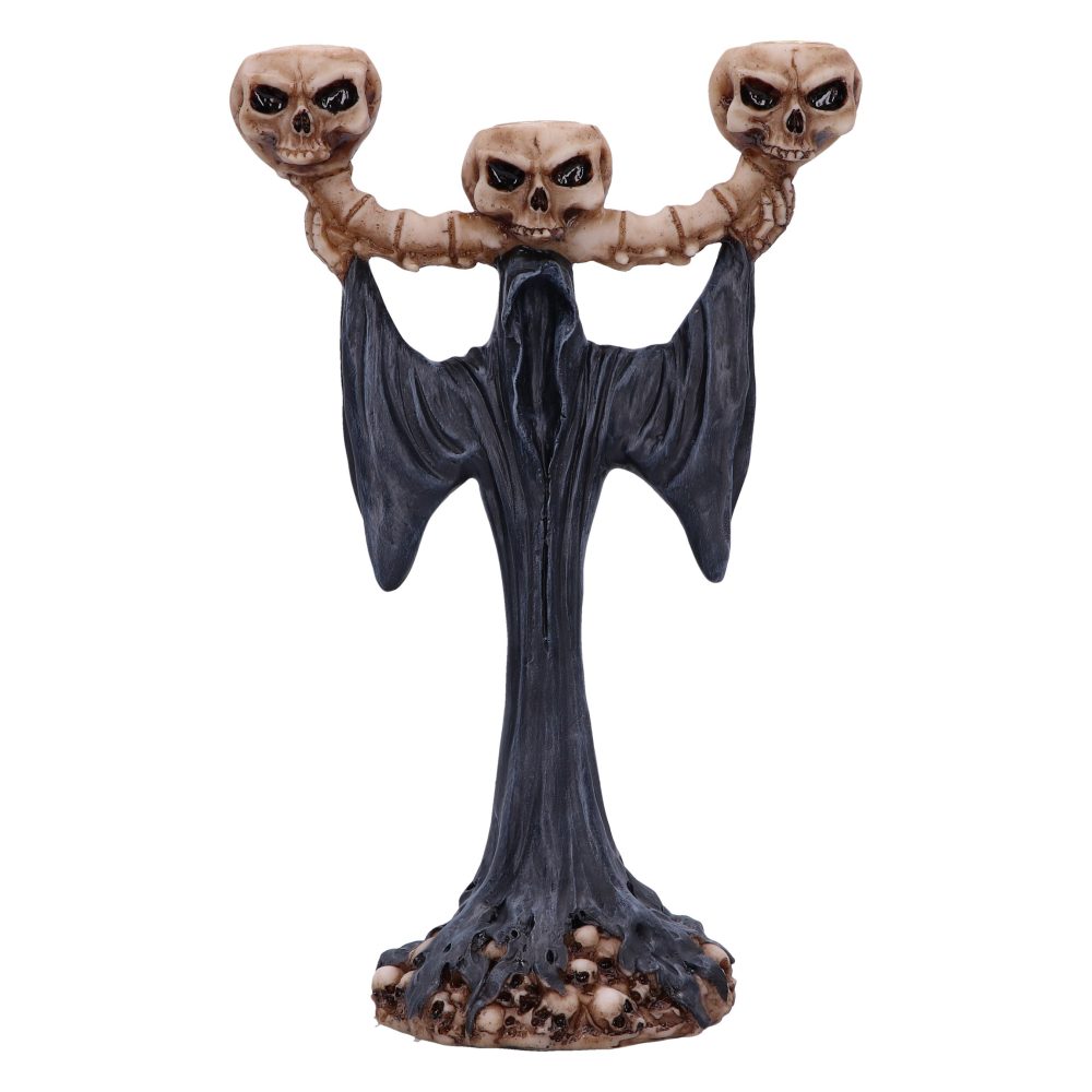 A dark, grim-reaper-like candle holder stands with arms raised, supporting a three-skull candelabra. Small skulls form the base, all against a white background.