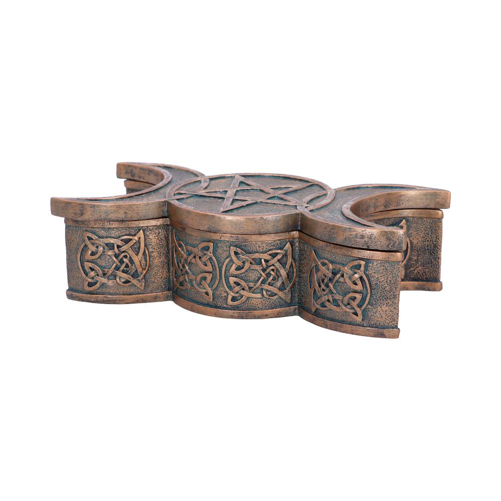 Bronze-colored trinket box, shaped like a Celtic cross, features intricate knot designs and a central pentagram, resting on a plain white background.