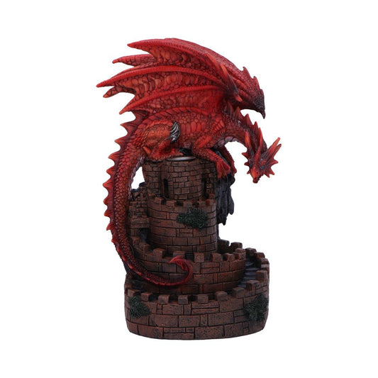 A red dragon figurine rests atop a miniature castle tower. The dragon is perched, its tail curled around the structure. The setting is isolated on a white background.