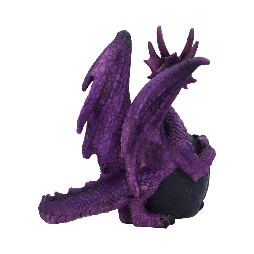 Purple dragon figurine is perched on a black spherical object, showcasing detailed scales and wings, set against a plain white background.