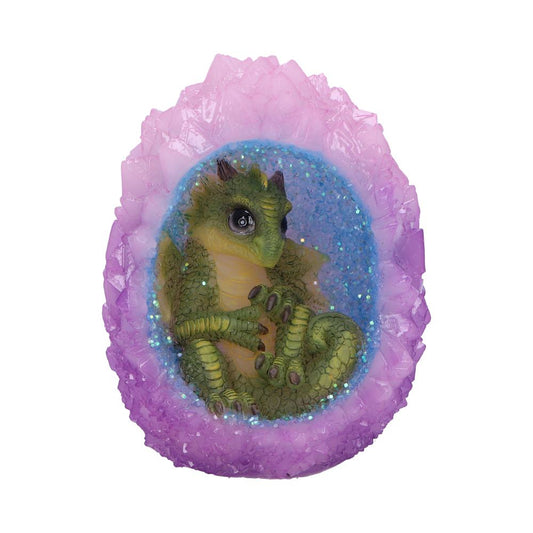 A green baby dragon curls inside a vibrant, geode-shaped egg, featuring glittery blue and purple crystals, creating a magical and fantastical ambiance.