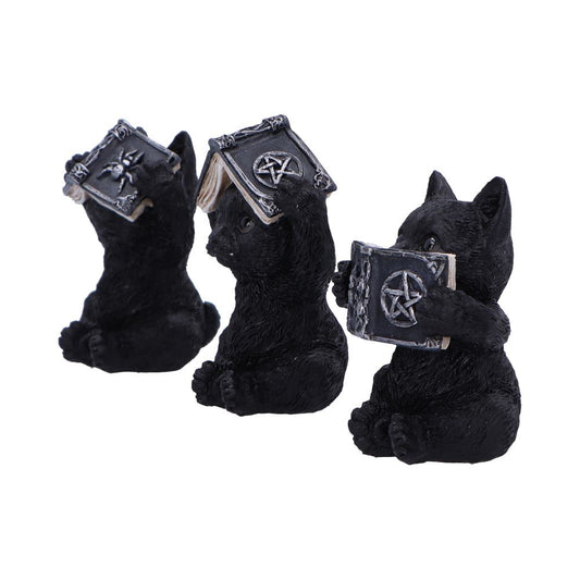 Three black cat figurines hold and interact with mystical books displaying pentagram symbols. One covers its eyes, another its ears, and the third its mouth, resembling "see no evil, hear no evil, speak no evil” poses.