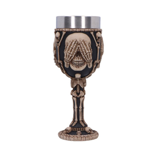 A decorative goblet, made of skulls and skeletons, has a silver insert. The cup is off-white and black in color, on a plain white background.