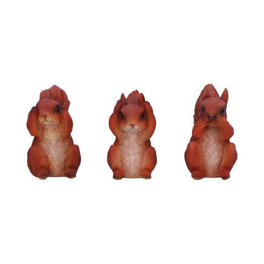 Three squirrel figurines sit in a row. Each covers its eyes, ears, or mouth with paws, illustrating the "see no evil, hear no evil, speak no evil" concept against a white background.