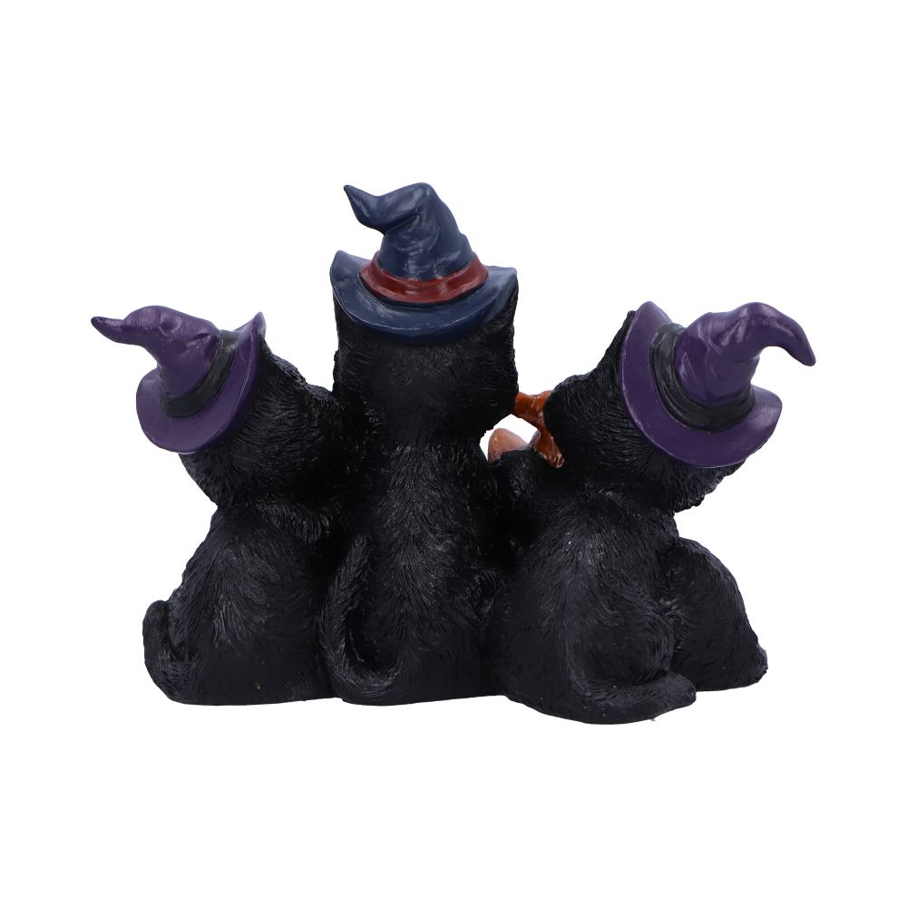 Three black cat figurines wearing witch hats sit closely together, viewed from behind. The hats are purple and blue with red and black details. The background is plain white.