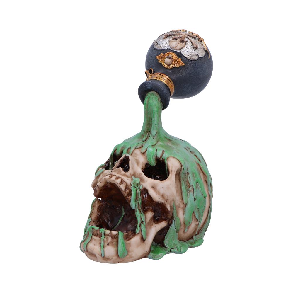 A decorative skull with green slime oozing from its openings supports a dark, ornate spherical container on top, featuring gold accents in a macabre design theme.