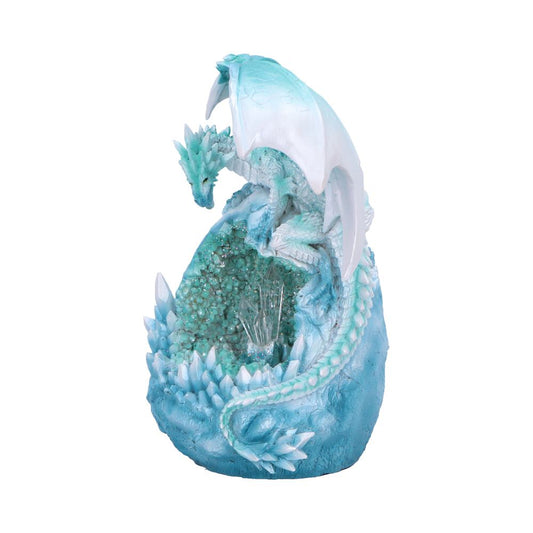 A detailed turquoise and white dragon figurine perched on a geode rock formation. Crystals and scales intertwine, creating an intricate fantasy sculpture with a sense of mythical elegance.