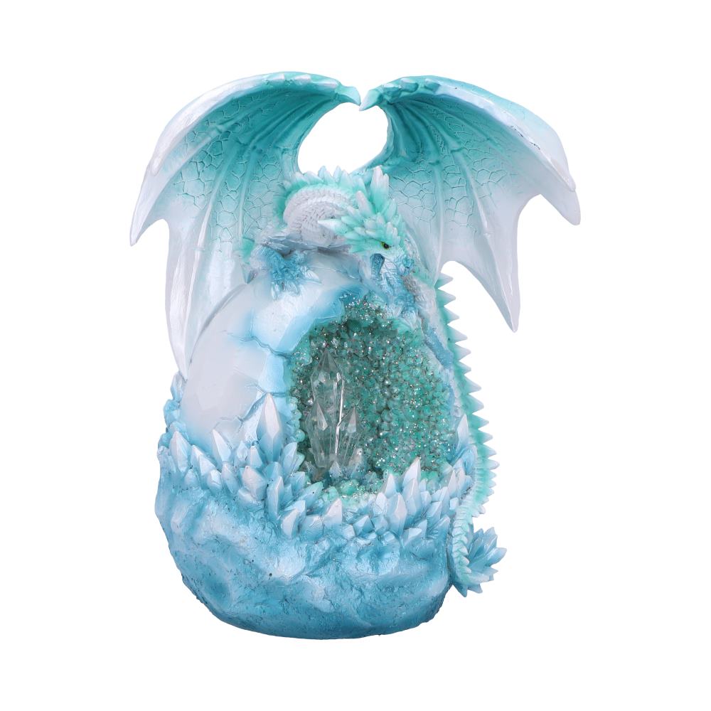 An icy-blue dragon cradles a large, cracked egg filled with turquoise crystals, its intricately detailed wings spread apart, set against a plain white background.