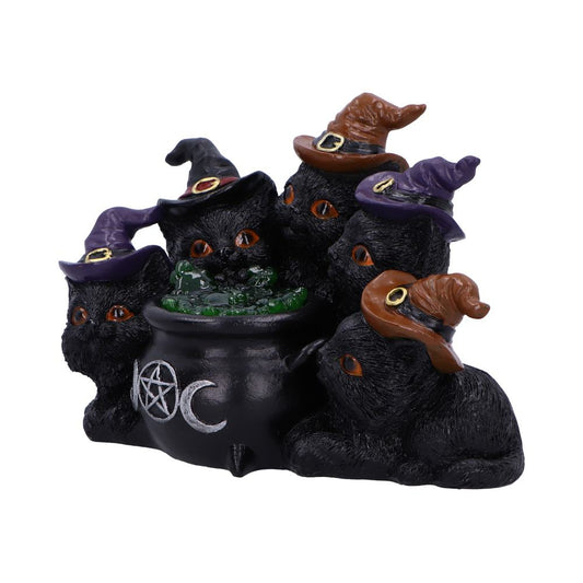 Five black cats wearing witch hats gather around a bubbling cauldron. The cauldron, adorned with a pentacle and crescent moon, is filled with green liquid.
