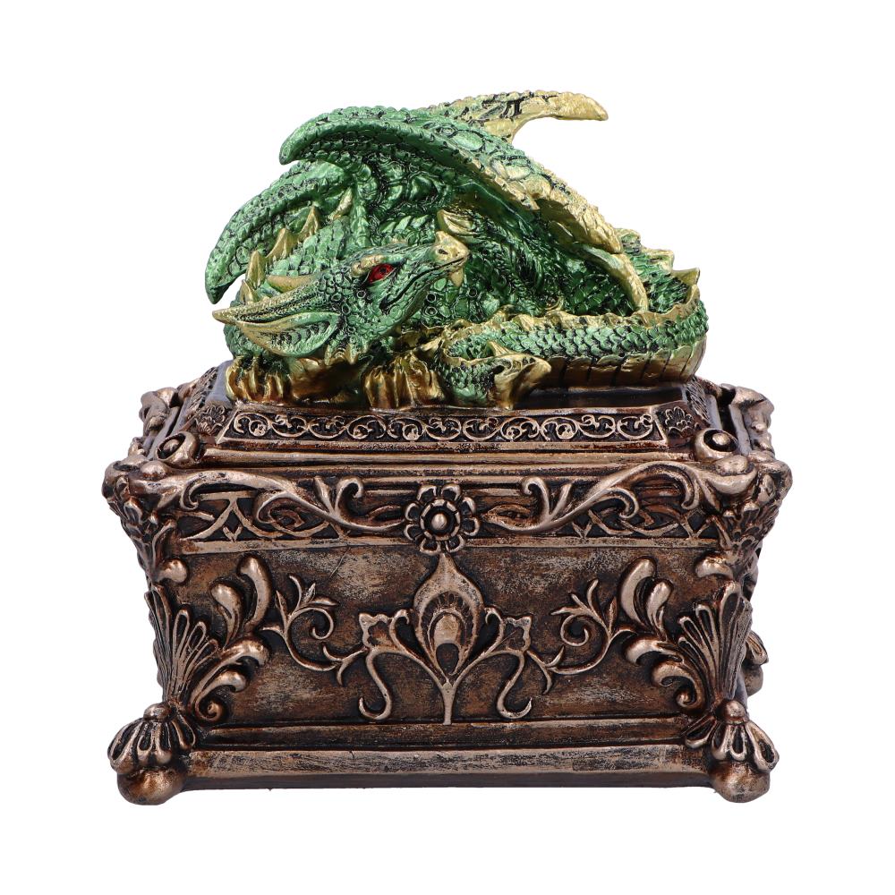 A detailed green dragon rests atop an ornate bronze box with intricate floral engravings, creating a decorative fantasy-inspired object.