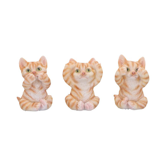 Three orange tabby kitten figurines sit side by side: left covers its mouth, center covers its ears, right covers its eyes, all with green eyes and folded paws against a white background.