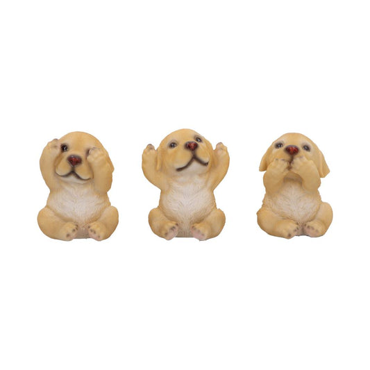 Three small tan puppy figurines sit in a row on a white background; left covers its eyes, center raises both paws, right covers its mouth.