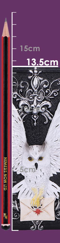 White owl clutching a sealed envelope with red wax seal and partially spread wings mounted on an ornate black plaque with a vertical pencil and measurement markings showing scale; text: NEMESIS NOW LTD, 15cm, 13.5cm, 5cm