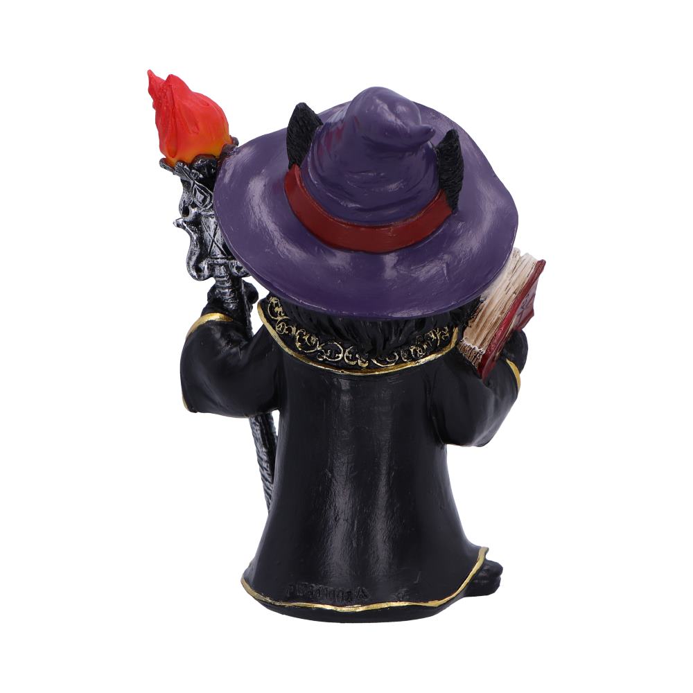 Wizard figurine wearing a purple hat holds a flaming staff in one hand and an open book in the other while standing on a plain white background.