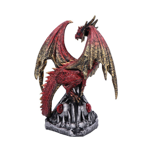 Red and gold dragon statue perches with wings raised, tail curled, atop a spiked silver-gray stone base adorned with red gem-like orbs against a plain white background.