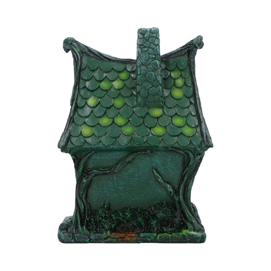 Green miniature fantasy house stands on a flat base, featuring scalloped roof tiles with chimney, twisted vine-like walls and small shrubbery against a plain white background.