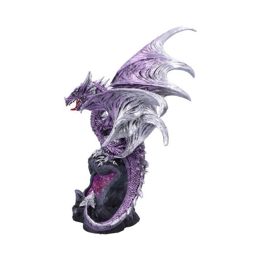 Purple dragon perches snarling atop a dark crystalline geode with silver-tinted wings unfurled and tail curled around the rock against a plain white background.