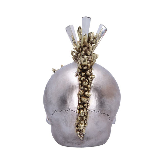 Silver skull viewed from the back displays a vertical gold crystal mohawk crest running from crown to nape against a plain white background.