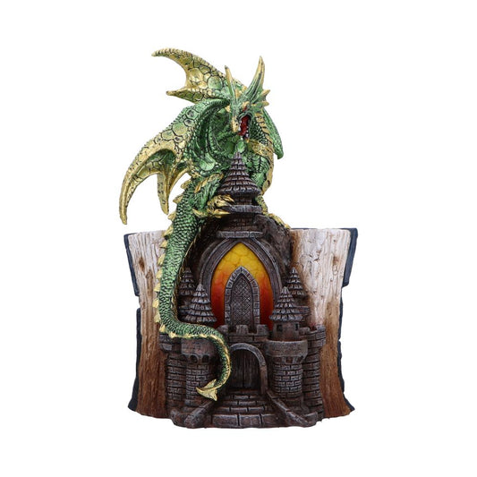 Green dragon figurine coils around and claws a stone castle turret set in a hollowed tree stump base with a glowing arched window against a white background.