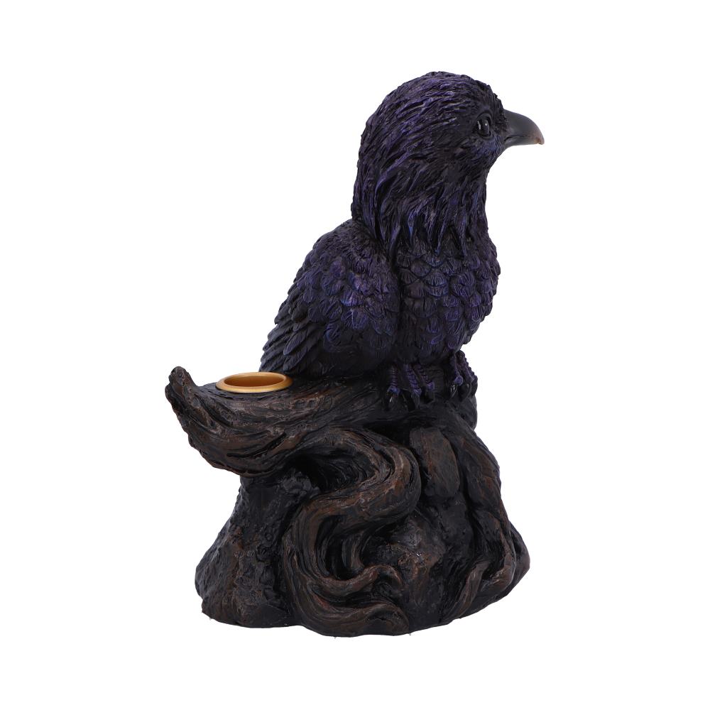 Purple raven figurine perches on a twisted dark wood-like base with a small round cup inset, displayed against a plain white background.