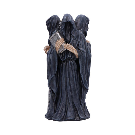 Three hooded, faceless robed figures stand merged as one, skeletal hands clutching a weathered book, dark flowing robes pooling at their feet against a plain white background.