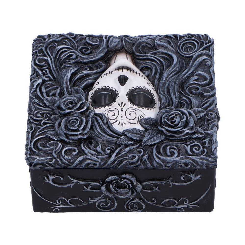 A decorative black jewelry box with a white sugar-skull mask peeking from swirling carved roses and vines, ornate gothic relief covering the lid and sides against a white background.
