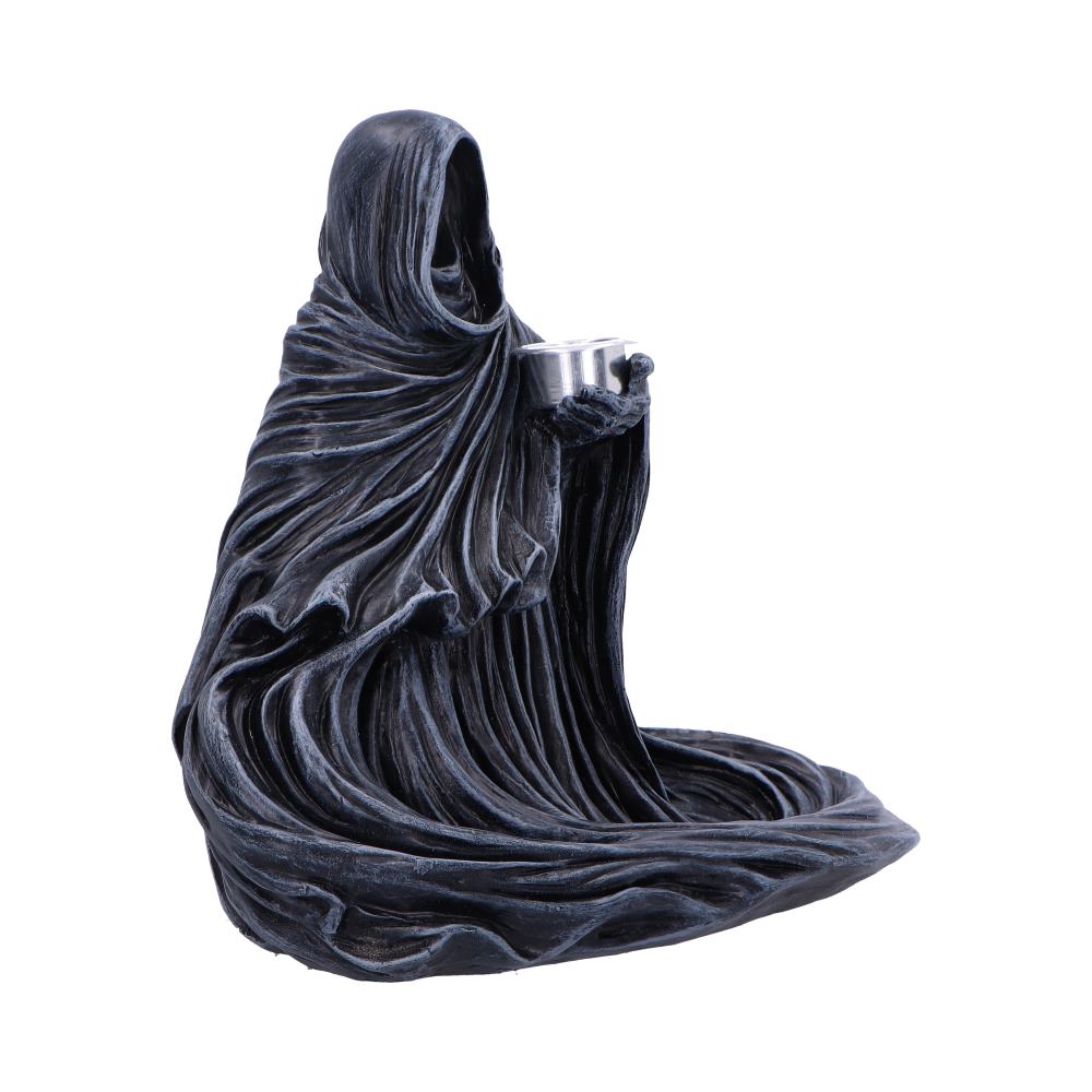 Cloaked hooded statue holds a small metal cup, draped fabric pooling around its base on a plain white background.