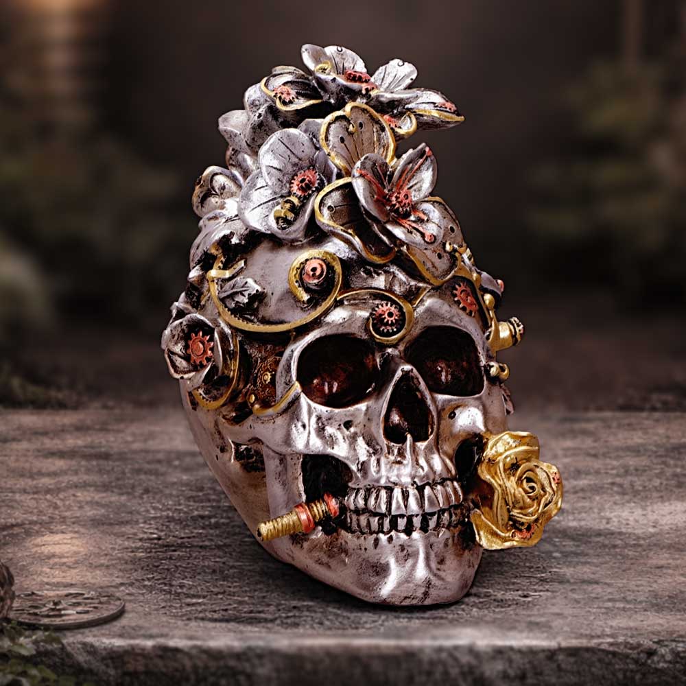 Clockwork Bloom Silver Steampunk Skull Ornament - silver-coloured floral skull in a workshop display