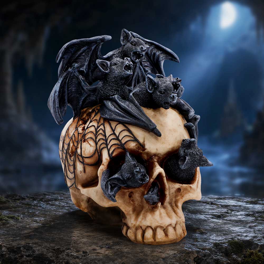 Swarm of Shadows Bat Skull Ornament - bat-covered skull displayed in a shadowy gothic setting