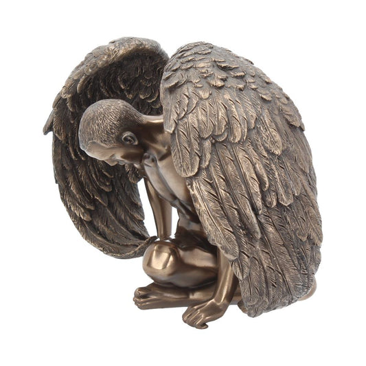 A detailed bronze statue depicts a kneeling figure with large, feathered wings folded protectively. The figure's head is bowed, creating an impression of introspection. The background is plain white.