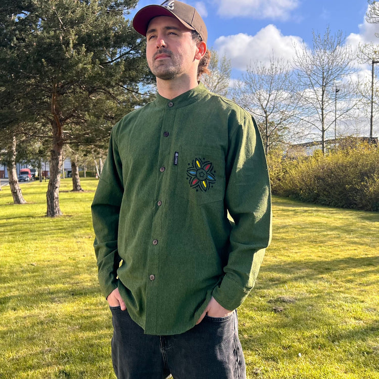 Model wearing a forest green Kathmandu-made grandad shirt with full-button front and relaxed boho fit.