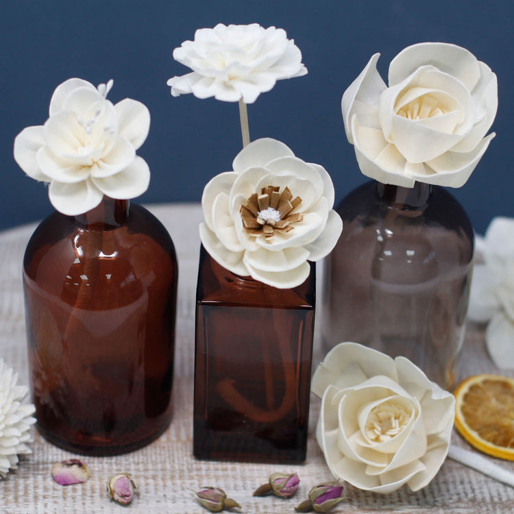 Diffuser accessories including bottles and diffuser flowers for custom home fragrance setups