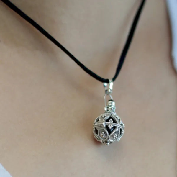 Handcrafted Balinese Silver Angel Bells with ornate 925 silver designs and chiming pendants on neck cords for spiritual jewellery UK