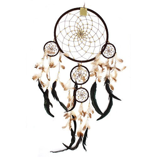 A brown dreamcatcher hangs, adorned with tan and dark-green feathers; smaller rings are nested below the main one.