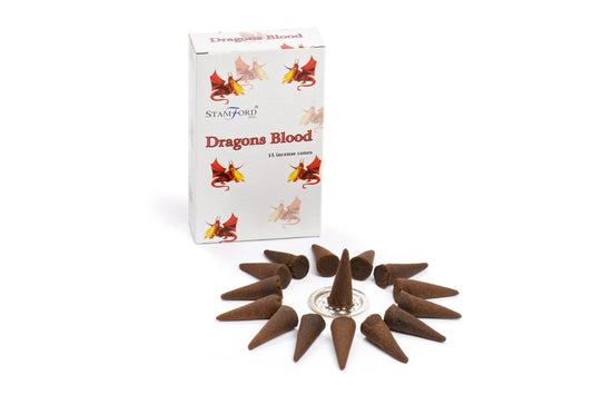 Box labeled "Dragons Blood" contains 15 incense cones. The cones are arranged around a small holder. The box features illustrations of dragons and the brand "Stamford Inc."