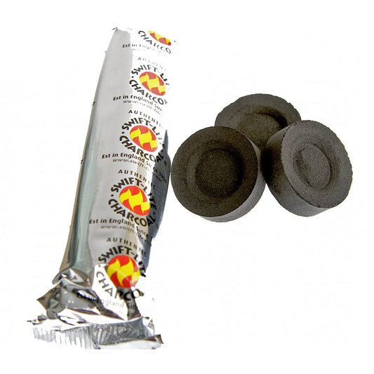 Three charcoal discs lie next to a silver foil wrapper labeled "Swift-Lite Charcoal." The text reads, "Est in England," "www.swiftlite.com," and "Authentic." The surrounding area is plain white.