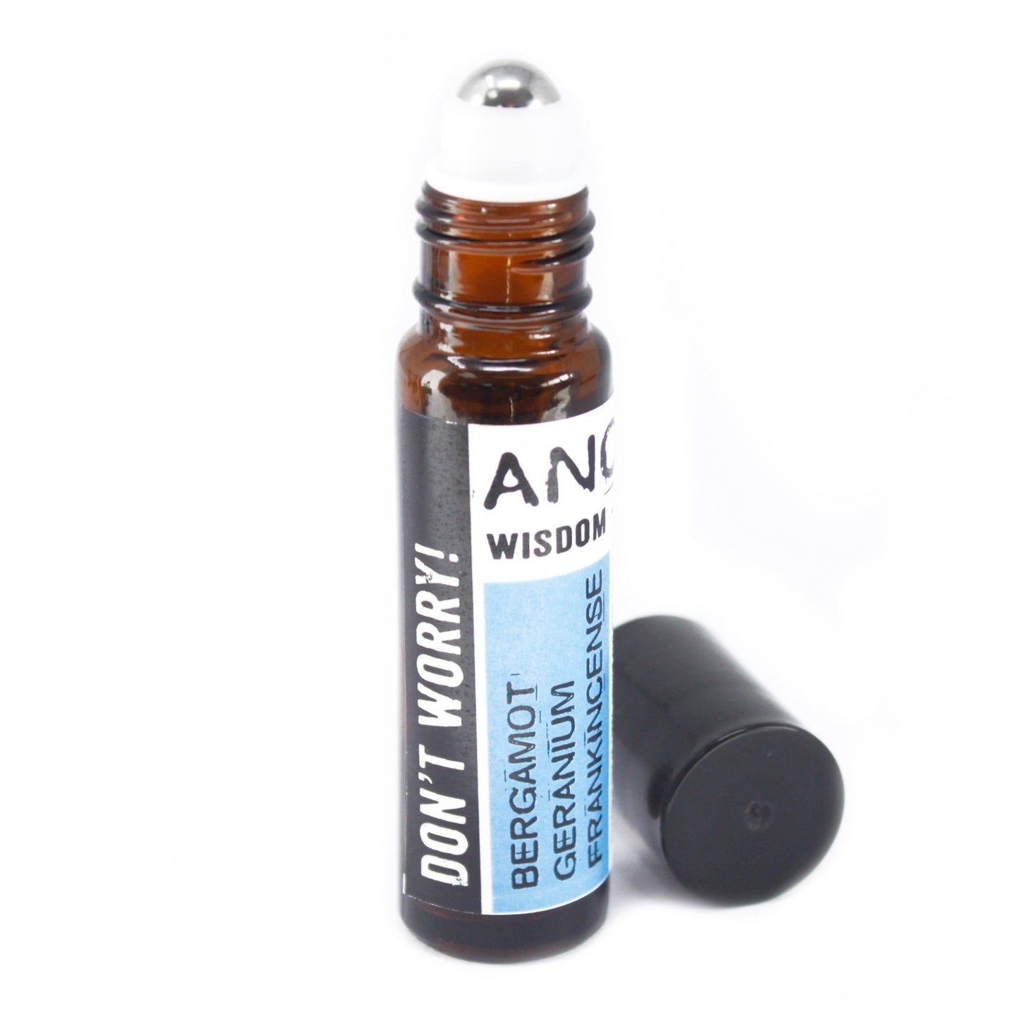 A brown glass roll-on bottle labeled "ANCIENT WISDOM" and "DON'T WORRY!" sits next to its black cap on a white surface. The label also lists Bergamot, Geranium, and Frankincense.