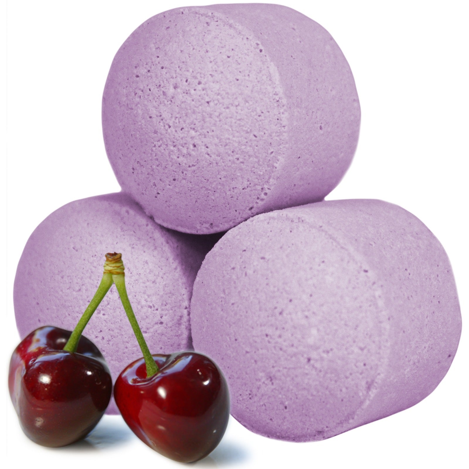 Purple cylindrical bath bombs are stacked in a pyramid with two glossy red cherries positioned in front. The background is plain white, highlighting the objects.