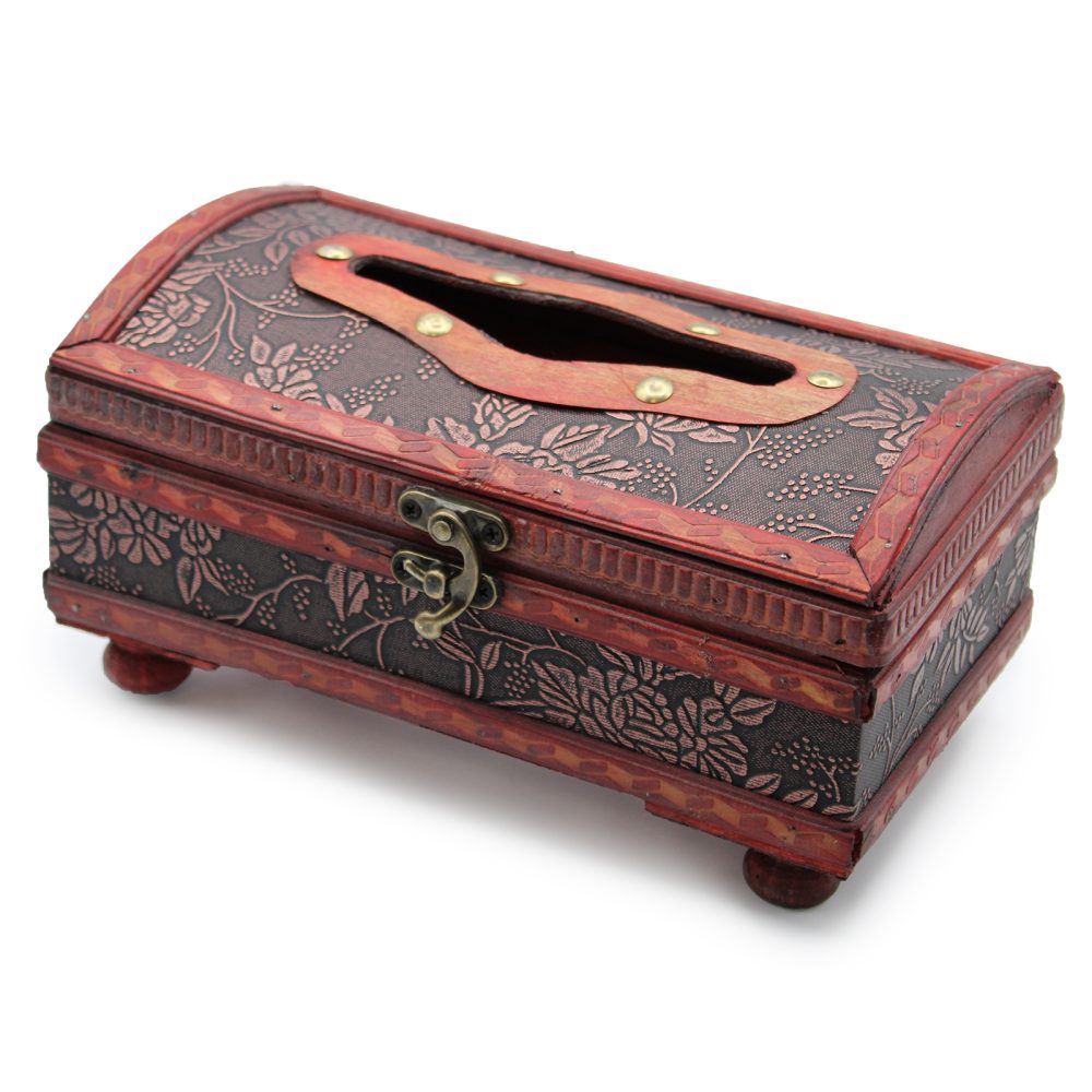 Wooden, intricately carved box with floral patterns and latch, designed for holding items, set on small feet. The lid features an oblong opening, suggesting use as a tissue holder.
