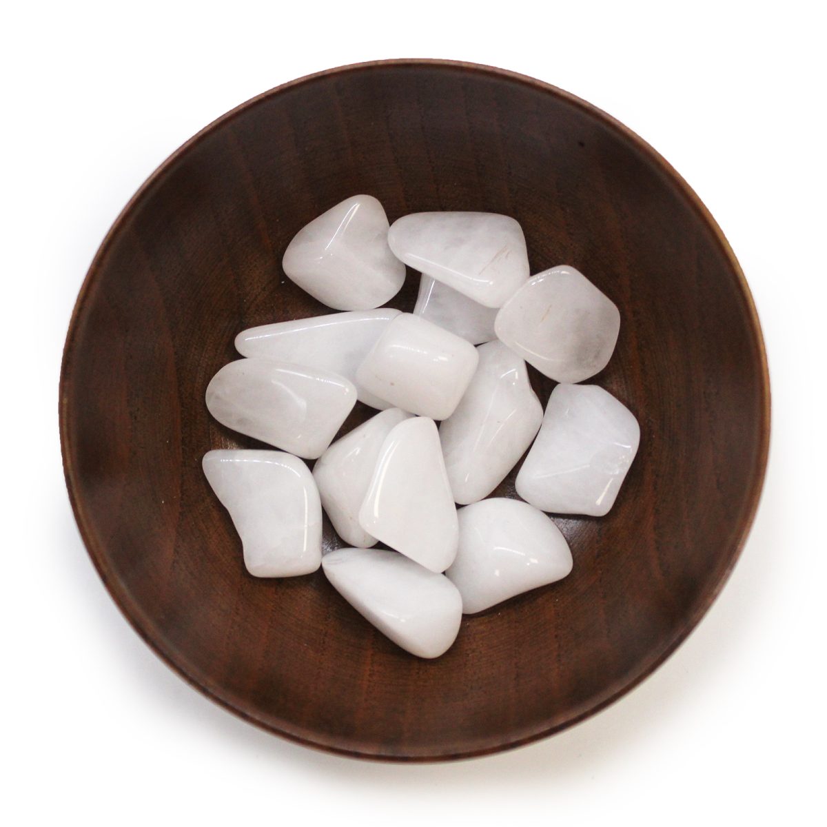 White, polished stones fill a small, round, wooden bowl. The bowl sits alone, centered, against a white background.